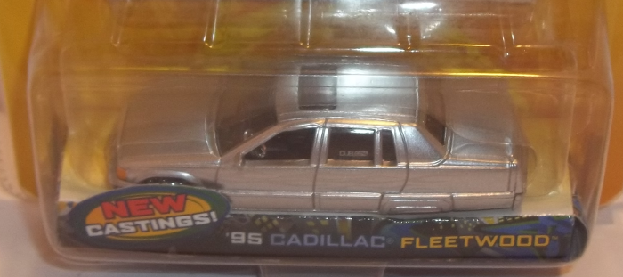 closeup of '95 Silver Cadillac Fleetwood model