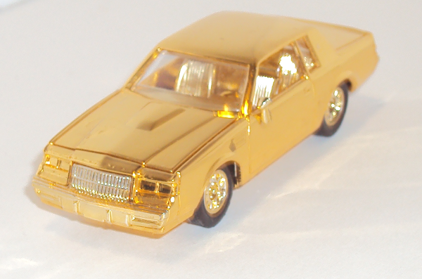 small shiny GOLD car by Racing Champions (front left side)