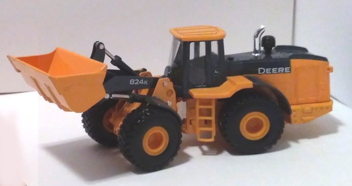 Deere 824K Wheel Loader with bucket lifted up - facing left