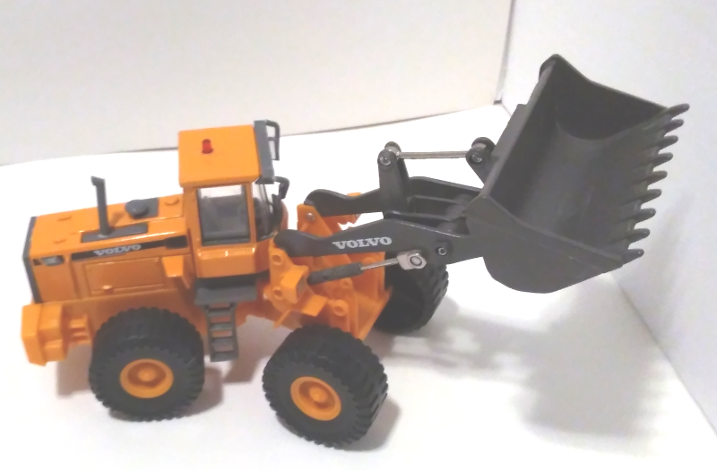 Volvo wheel loader (right-side view)-in a sandy orange colour