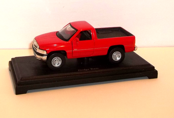 Maisto Red Dodge Ram Pickup Truck on black platform