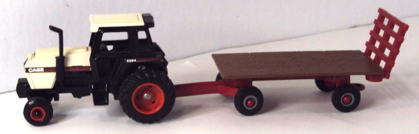 2294 Case Tractor with brown/red backrack on flat trailer (left-side)