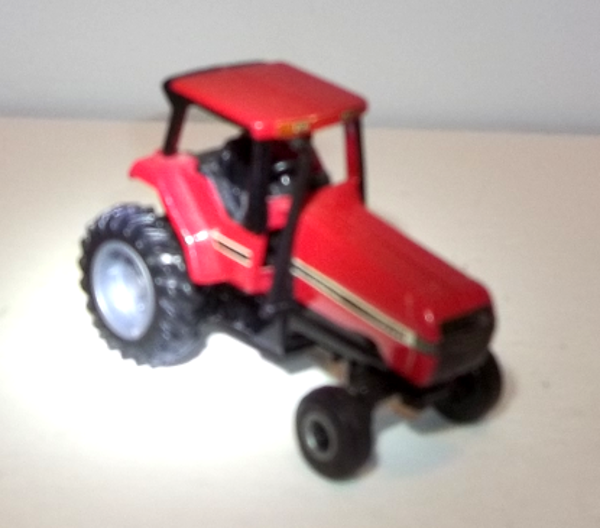 7210 Red Case IH Row Tractor of the Magnum 7200 series in 1:64 scale (right front-view)