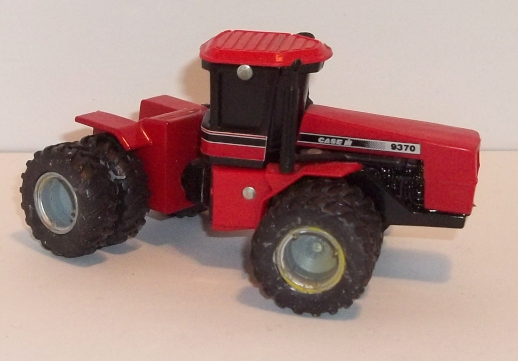 9370 red Case IH tractor with dual wheels, one-way-black-Cab windows, right-side-view