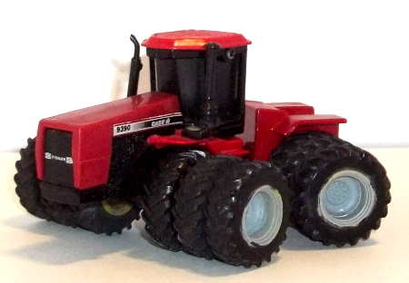 Case IH Steiger 9390 tractor with triple tires at each corner, and tinted windows -Left side view