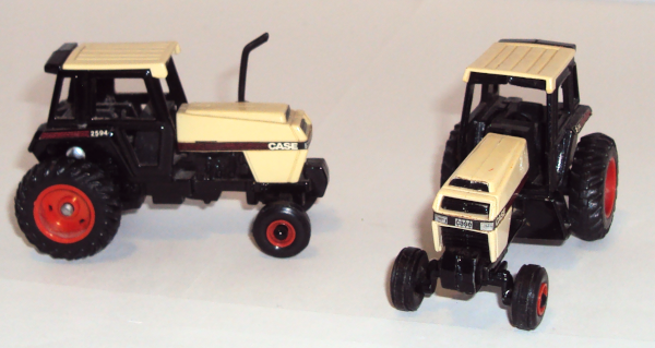 two vintage 2594 Case tractors ready for work