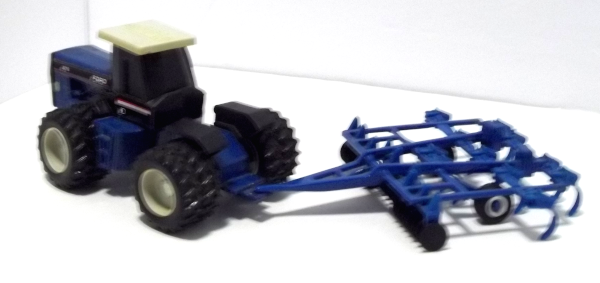 Blue Ford 876 Tractor with blue harrow (left rear-view)