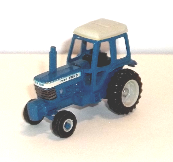 Small Blue Ford TW20 Tractor with White Canopy