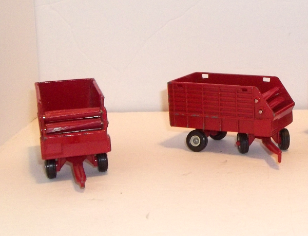 1:64 scale, (2) IH red forage wagons, front and right sides, no tops