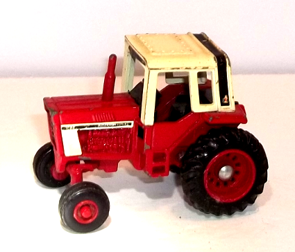 Vintage 1086-International small tractor with off-white canopy (used)