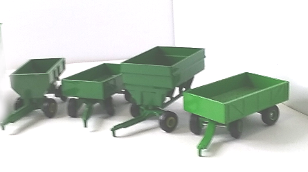 4 green farm wagons lined up