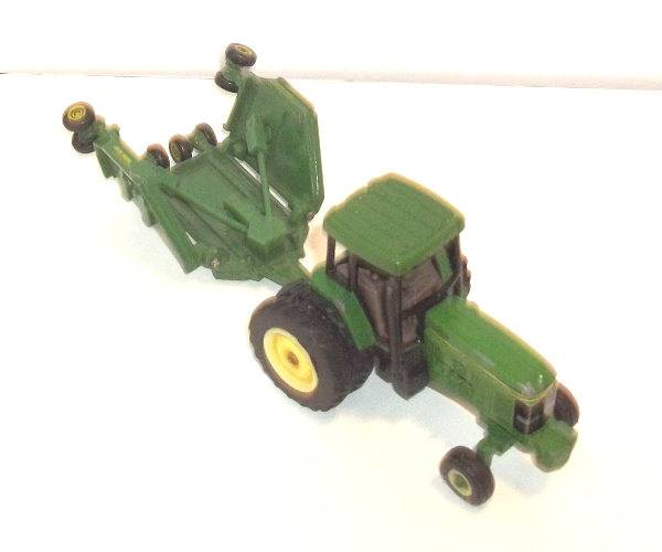 John Deere tractor with Paladin tool with wings up (viewed from above)
