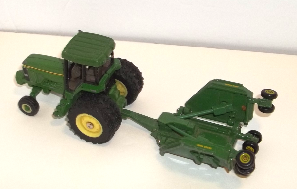 John Deere tractor with Paladin attachment with wings up