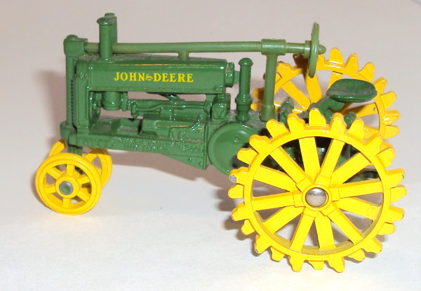 Vintage John Deere tractor with yellow-all-metal wheels