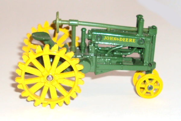 Vintage John Deere tractor, yellow all-metal wheels (right side view)