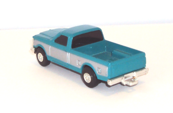 1990 Ford Pickup F250 teal with sliver sides (above left view)