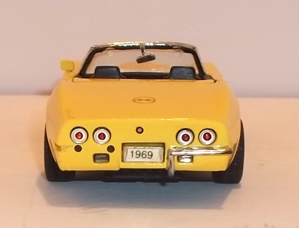 rear end view of this 1969 yellow Stingray Corvette Convertible